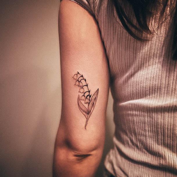 Girl With Graceful Lily Of The Valley Tattoos