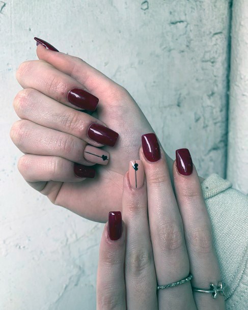 Girl With Graceful Maroon And Black Nails