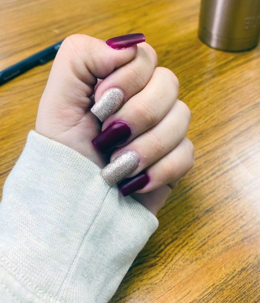 Girl With Graceful Maroon And Silver Nails