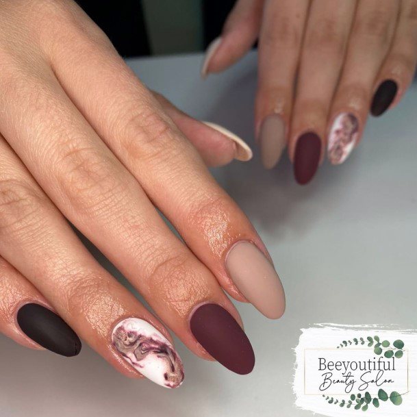 Girl With Graceful Matte Maroon Nails