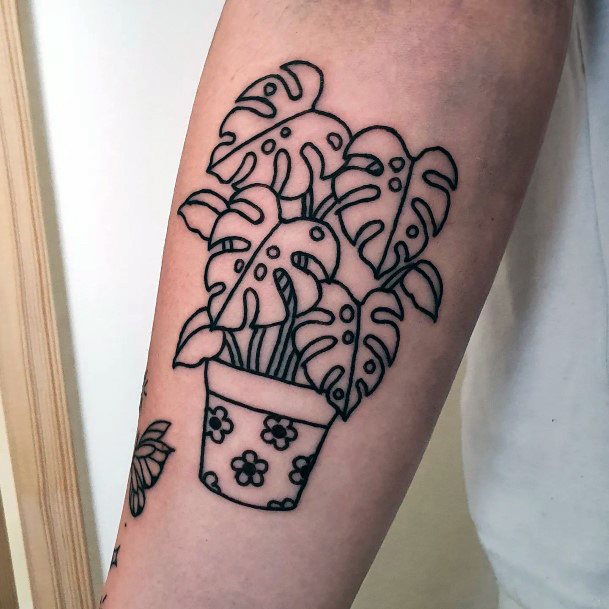Girl With Graceful Monstera Tattoos