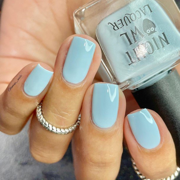 Girl With Graceful Pale Blue Nails