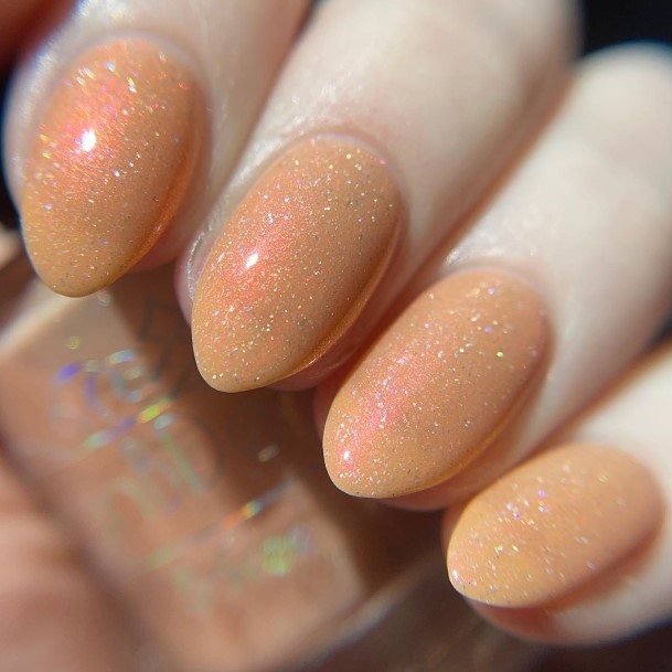 Girl With Graceful Peach With Glitter Nails