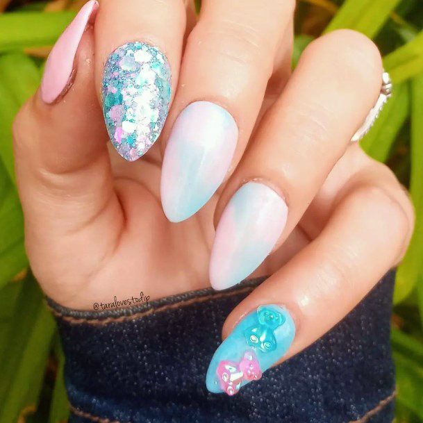 Girl With Graceful Pink And Blue Nails