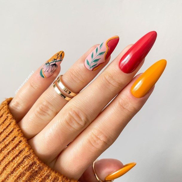 Girl With Graceful Red And Yellow Nails