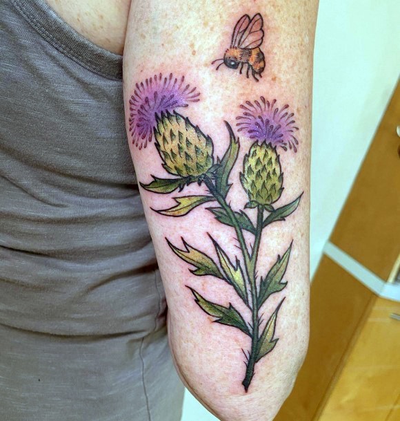 Girl With Graceful Thistle Tattoos