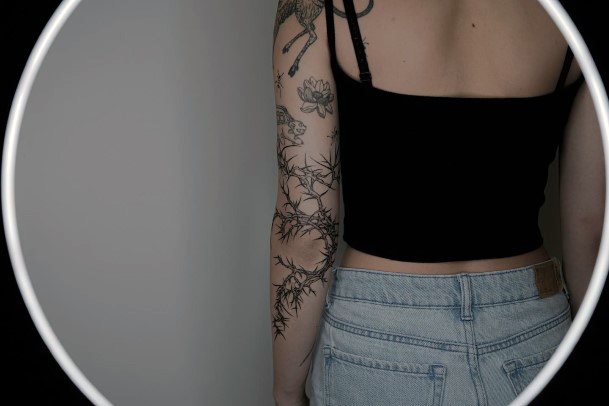 Girl With Graceful Thorns Tattoos