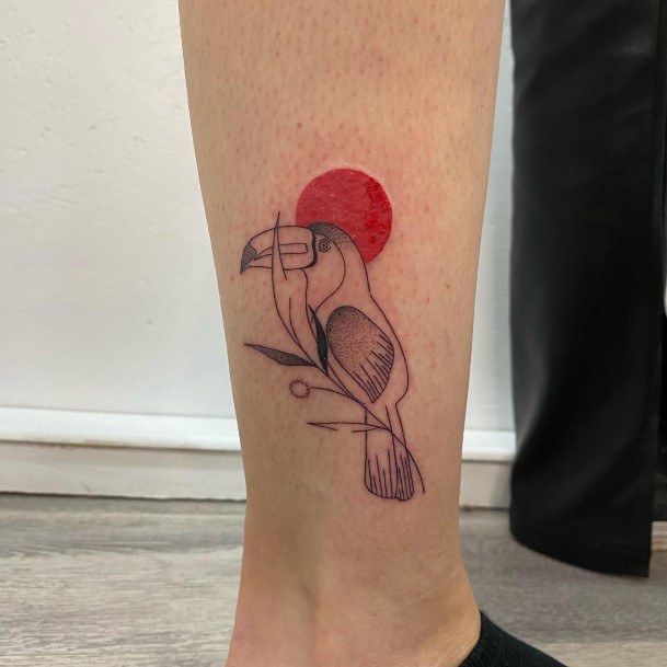 Girl With Graceful Toucan Tattoos