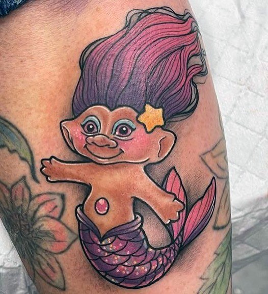 Girl With Graceful Troll Doll Tattoos