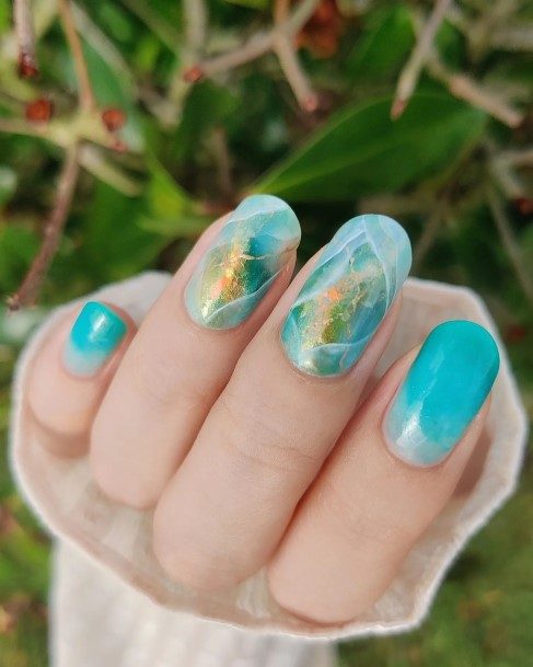 Girl With Graceful Turquoise Ombre Nails