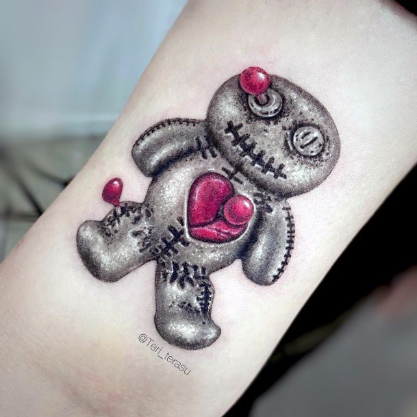 Girl With Graceful Voodoo Doll Tattoos