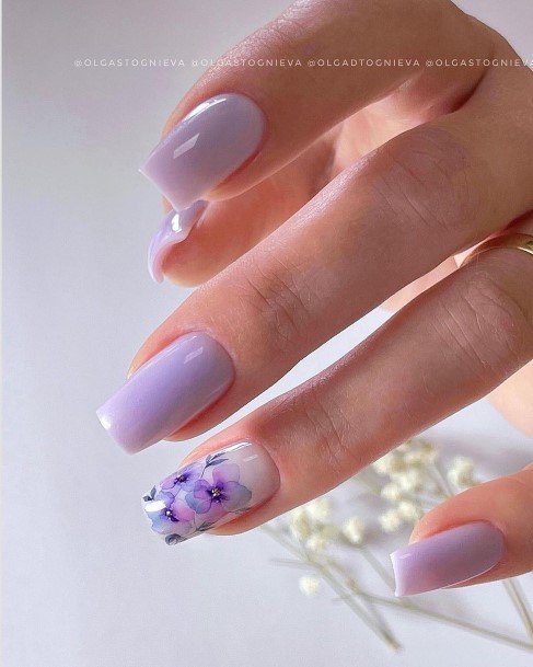 Girl With Graceful White With Flowers Nails