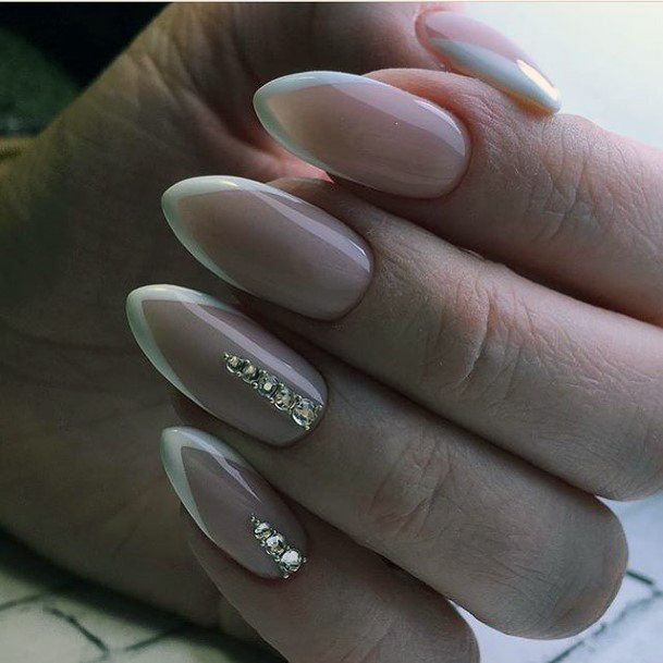 Girl With Graceful White With Rhinestones Nails