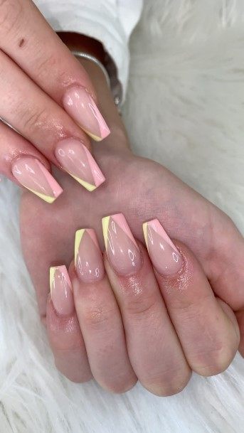 Girl With Graceful Yellow And Pink Nails