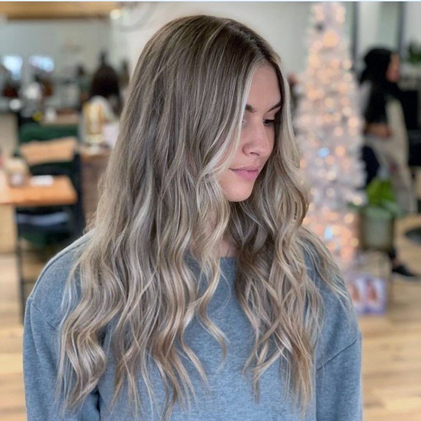 Girl With Stunning Light Blonde Ash Toned Highlights For Long Curly Hairstyle