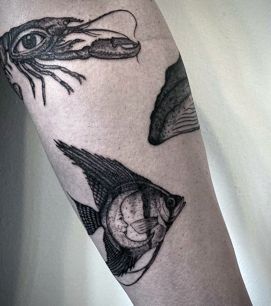 Girl With Stupendous Angel Fish Tattoos