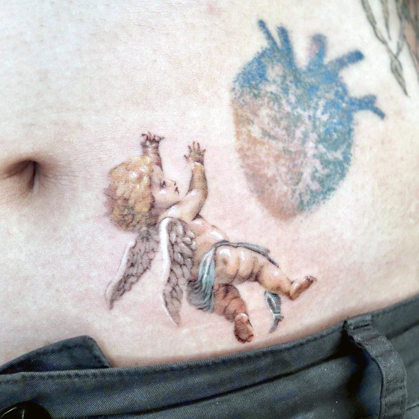 Girl With Stupendous Baby Angel Tattoos