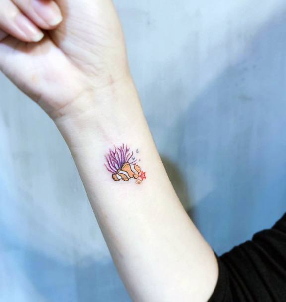 Girl With Stupendous Clown Fish Tattoos