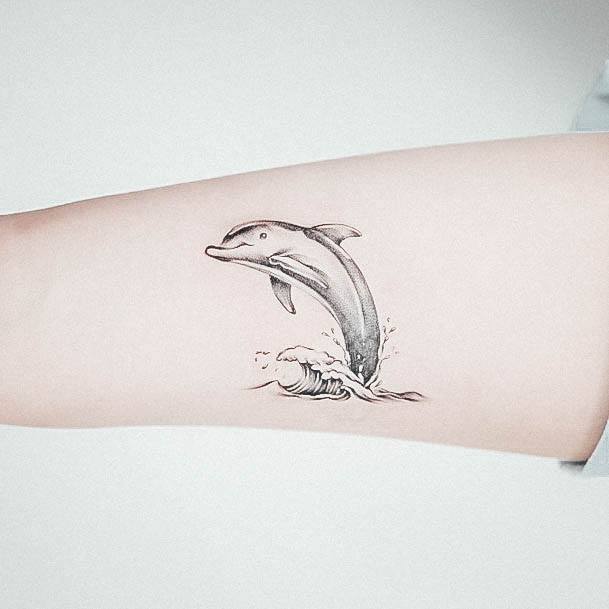 Girl With Stupendous Dolphin Tattoos