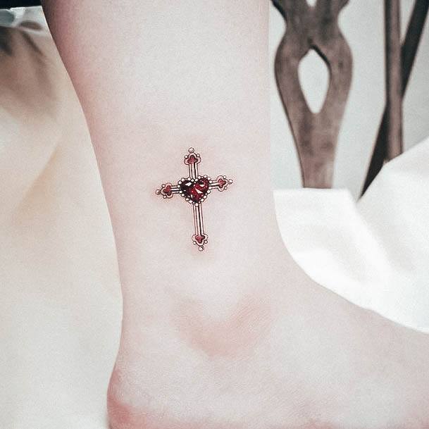 Girl With Stupendous Gem Tattoos Cross Ankle