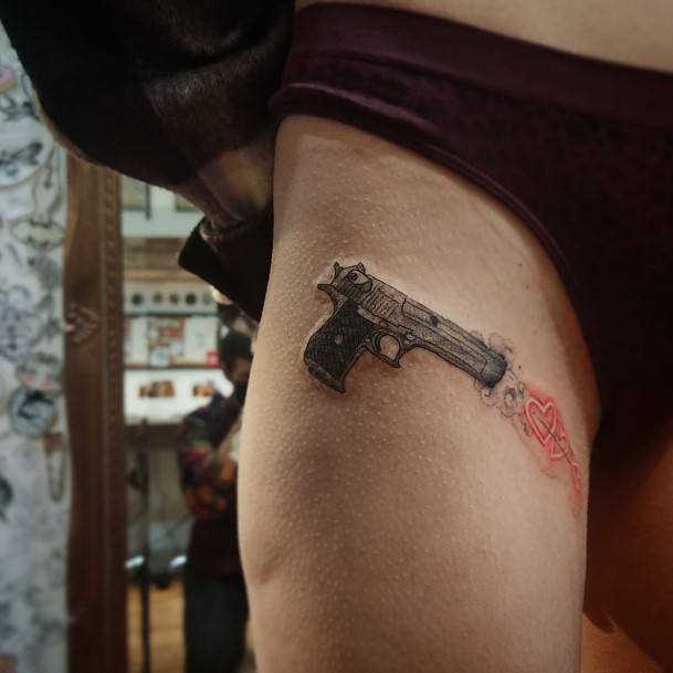 Girl With Stupendous Gun Tattoos