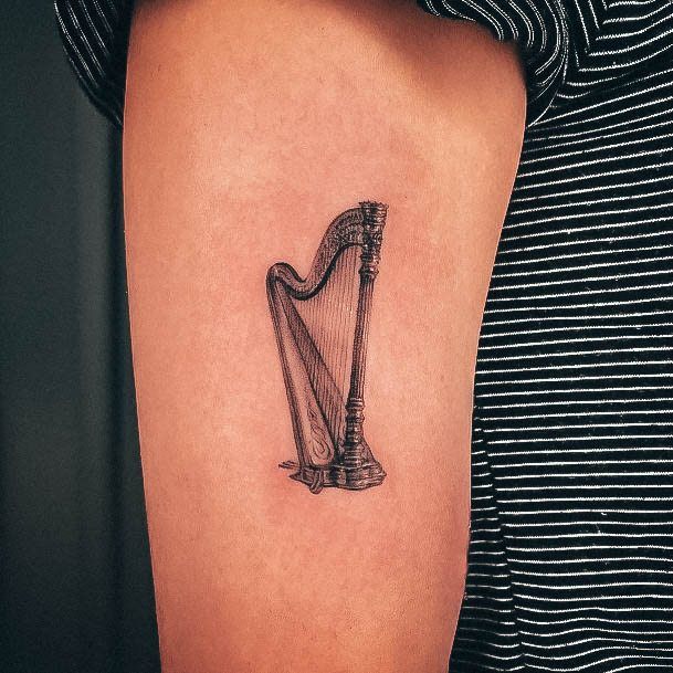 Girl With Stupendous Harp Tattoos