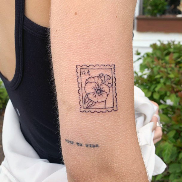 Girl With Stupendous Postage Stamp Tattoos