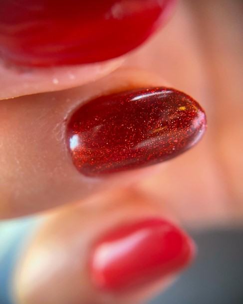 Girl With Stupendous Red Glitter Nails