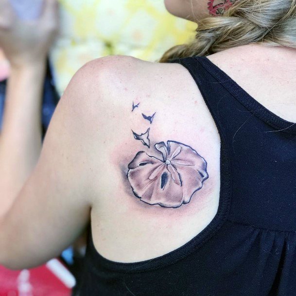 Girl With Stupendous Sand Dollar Tattoos
