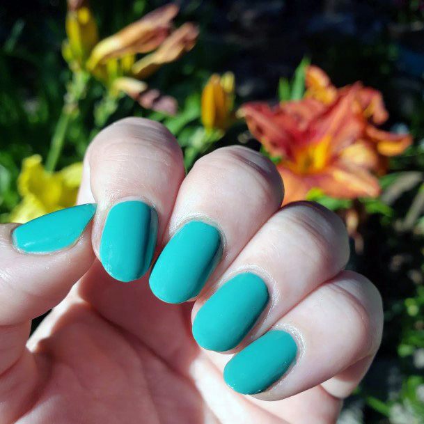 Girl With Stupendous Teal Turquoise Dress Nails