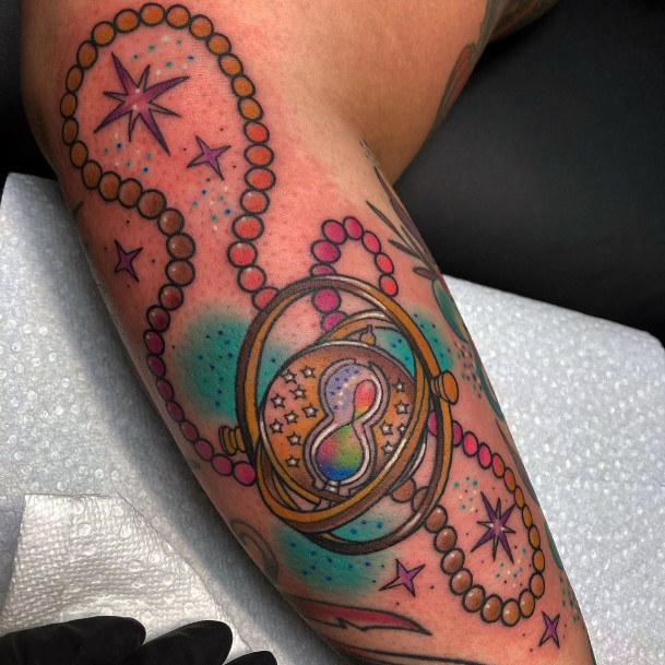 Girl With Stupendous Time Turner Tattoos