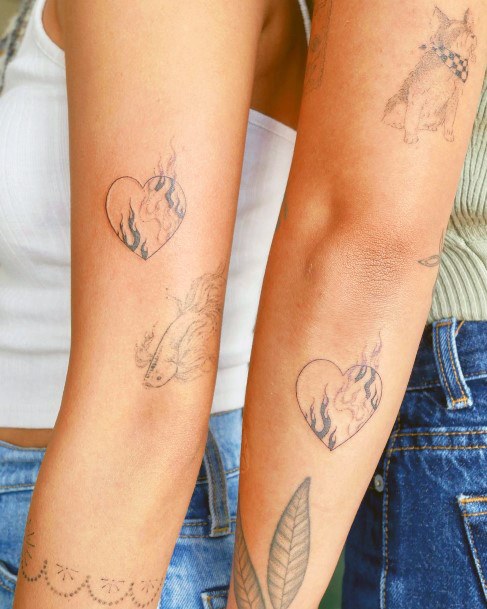 Girls Flaming Heart Tattoo Ideas