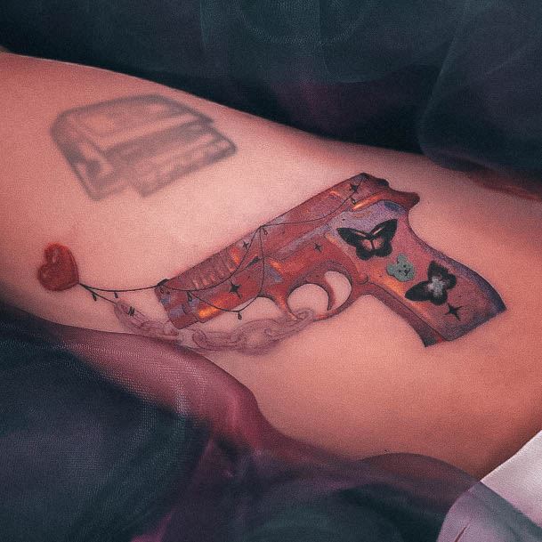 Girls Tattoos With Gun