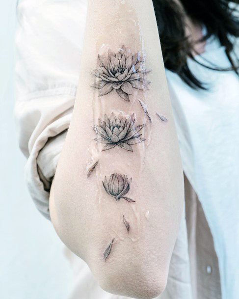 Girls Tattoos With Water Lily