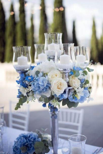Glass Candles And Blue Wedding Flowers