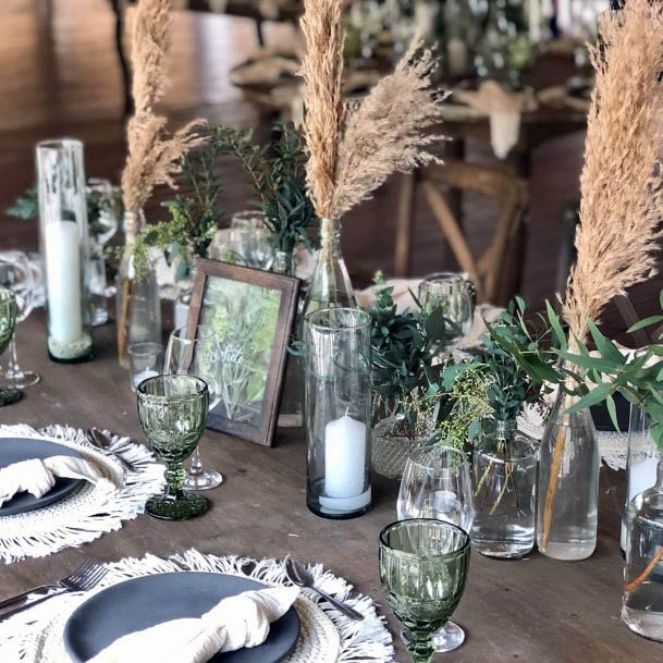 Glasses And Plates Beach Wedding Flowers