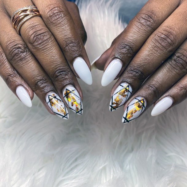Glinting Gold On White Almond Nails