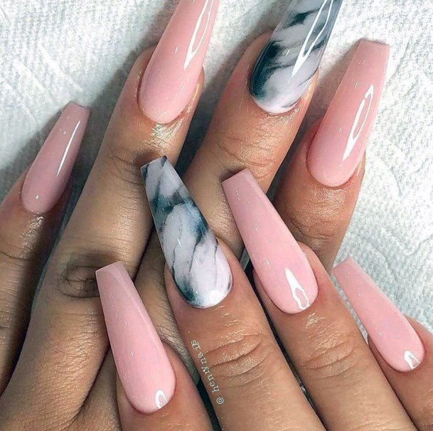 Glossy Coral Nails With Marble Accent For Women