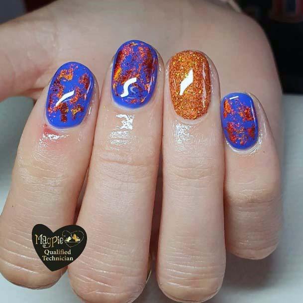 Glossy Golden Foils On Blue And Orange Nails For Women