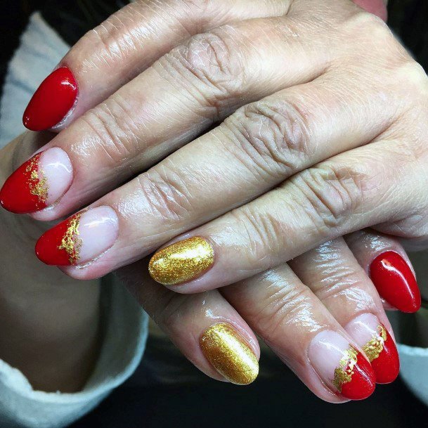 Golden Accent And Red Tipped Nails Women