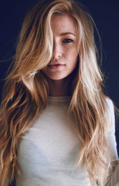 Golden Blonde Long Airy Hair Side Part And Cascading Wave