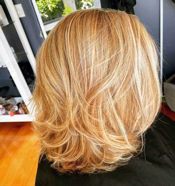 Golden Blonde Shoulder Length Shiny Hair With Volume Side Part