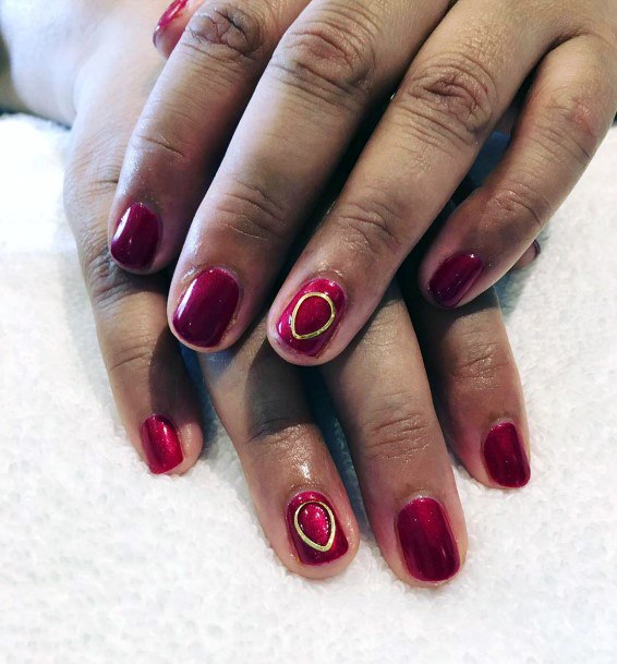 Golden Circle Art On Dark Red Nails