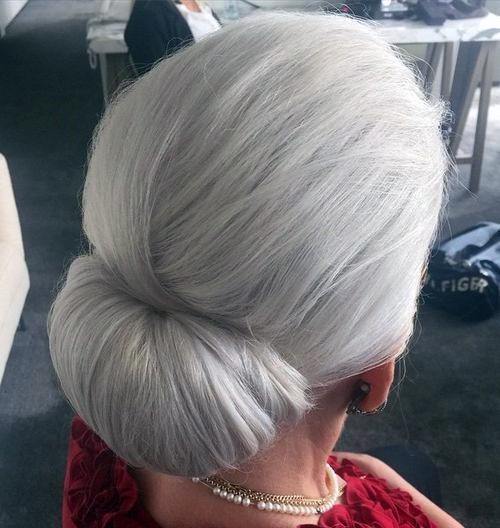 Hairstyles For Women Over 50 Sleek Natural Grey Chignon