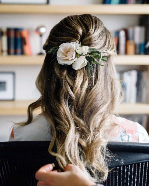 Half Up Pull Back Hairstyle With Large Curls And Floral Tie Back