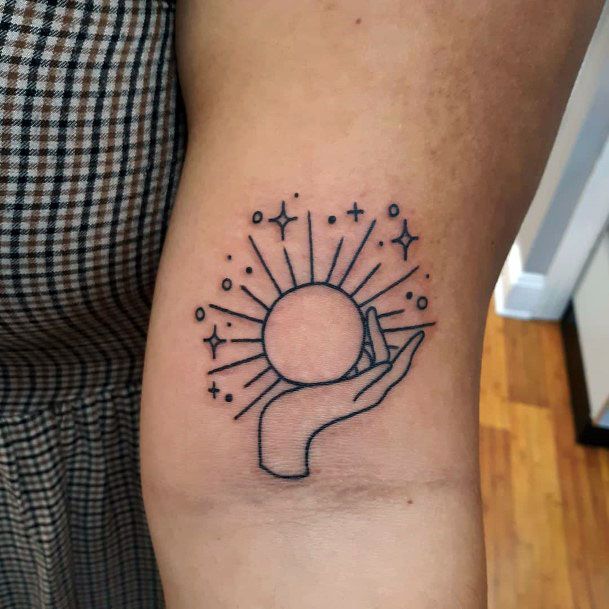 Hand Holding Sun Tattoo For Women