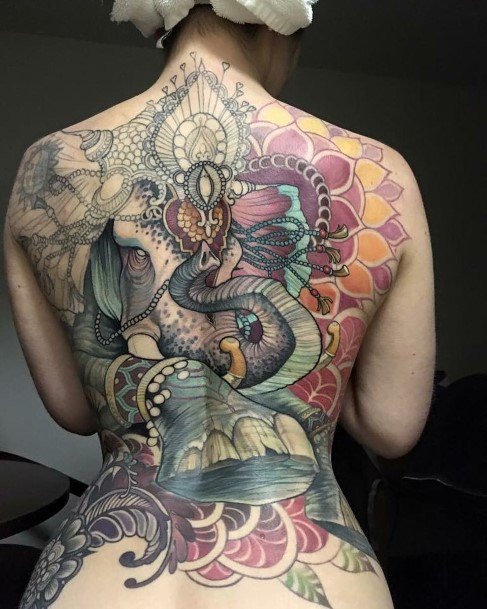 Heavily Decorated Womens Back Elephant Tattoo