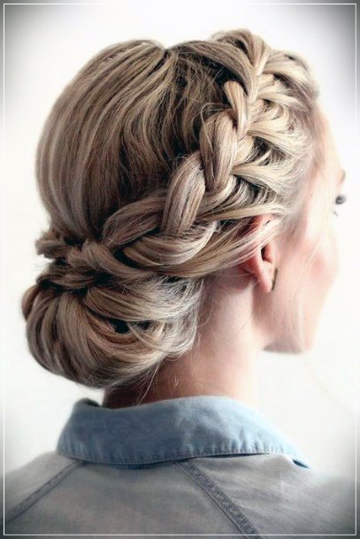 Icy Blonde Updo With Wide Side Braid Leading To Bun On Base Of The Neck