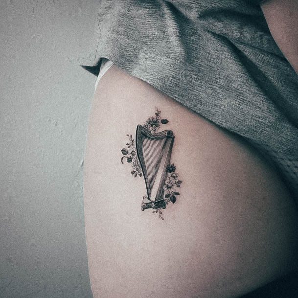 Impressive Ladies Harp Tattoo