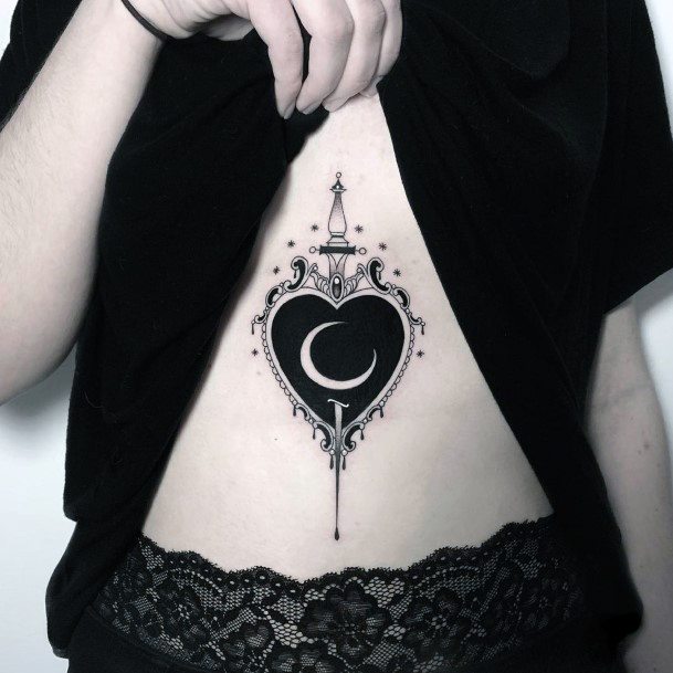 Incredible Dagger Heart Tattoo For Ladies